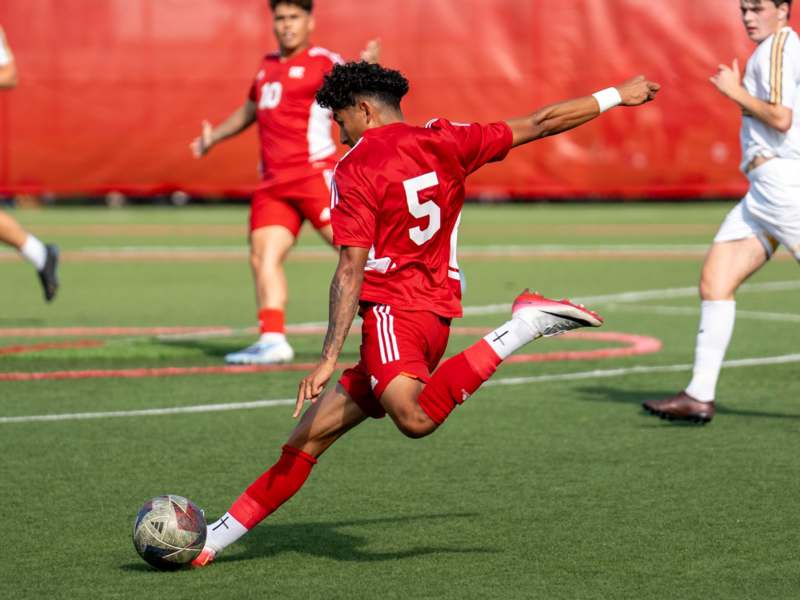 a football player kicking a ball