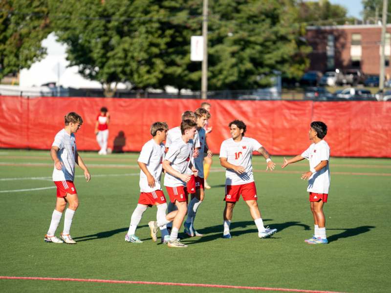 Soccer vs Anderson University (09/10/25) - a group of men in white and red uniforms on a field