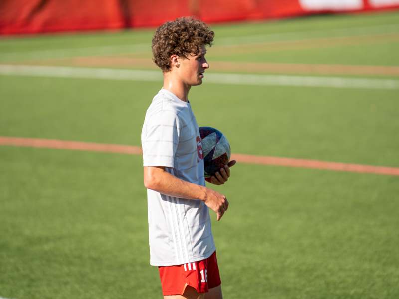 a man holding a football ball
