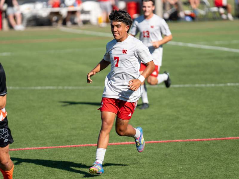 a boy running on a field