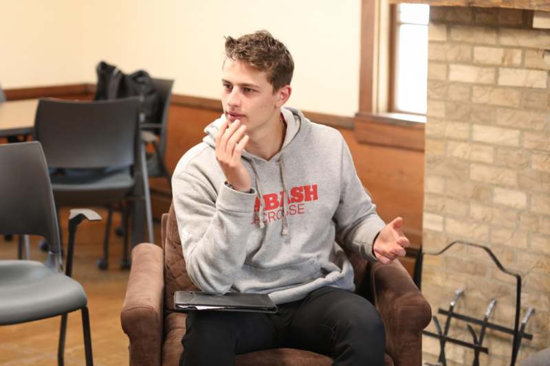 Wabash Democracy and Public Discourse - a man sitting in a chair