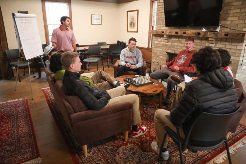 a group of people sitting around a table