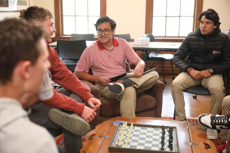 a group of people sitting around a table
