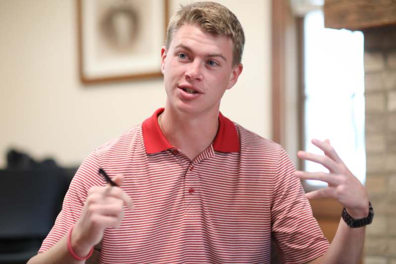 a man in a red and white striped shirt