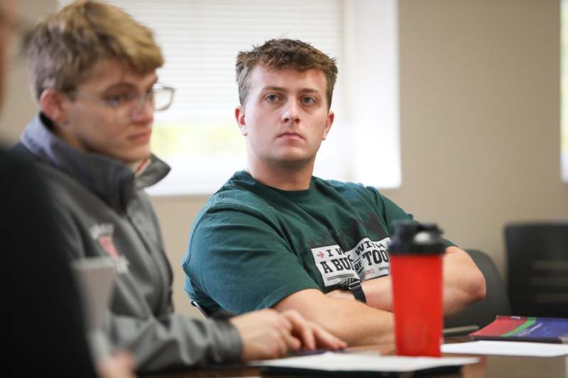 a group of people sitting at a table