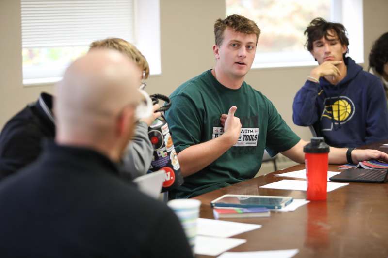 a group of people sitting at a table