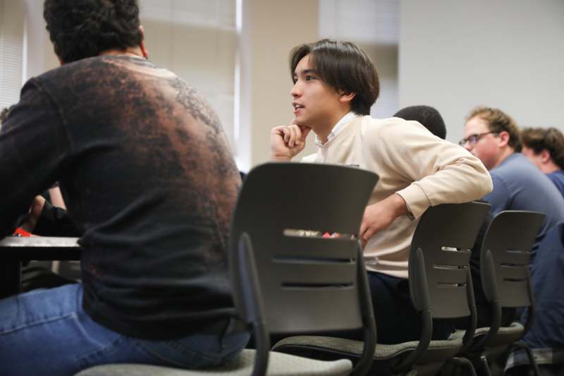 a group of people sitting in chairs