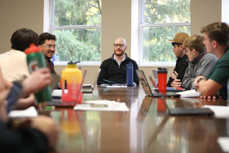 a group of people sitting around a table