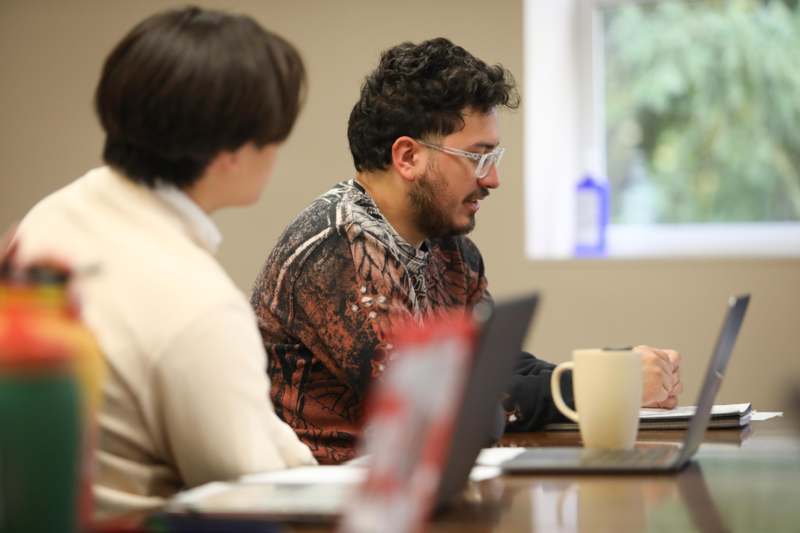 a group of people sitting at a table