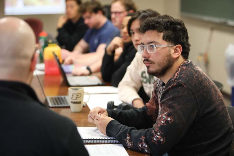 a group of people sitting at a table