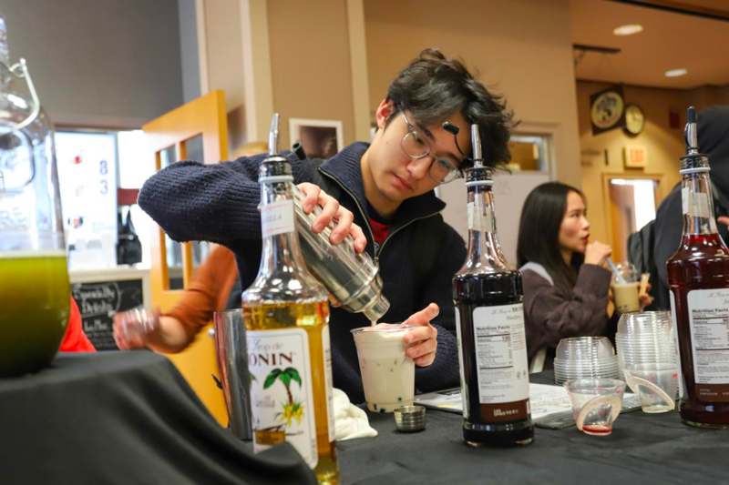 Asian Studies Tea - a man pouring a drink into a cup