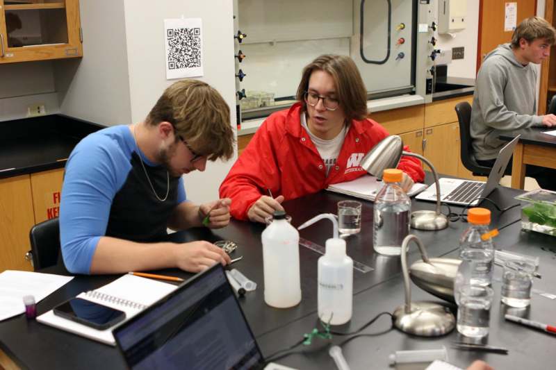 a couple of people sitting at a table