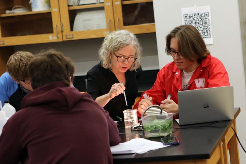 a group of people sitting around a table
