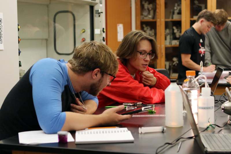 a group of people sitting at a table