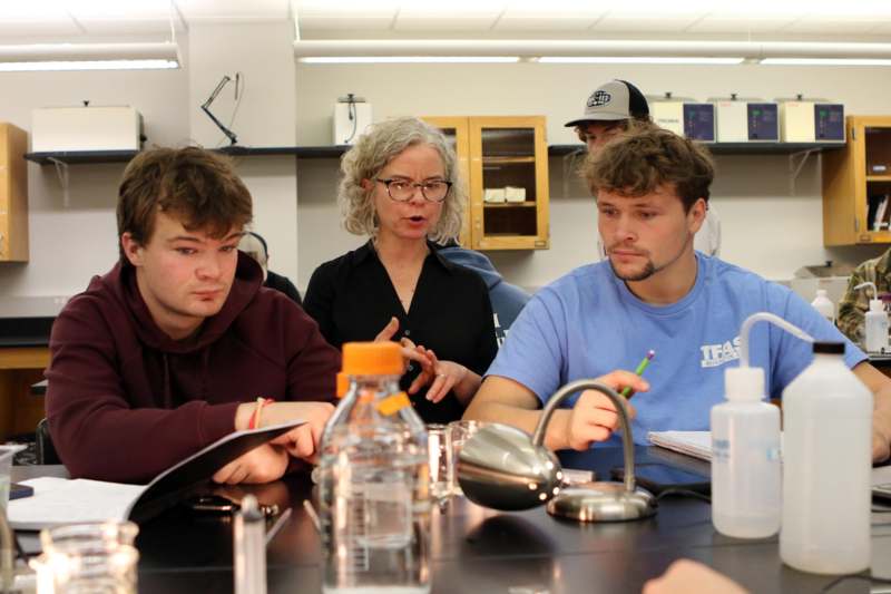 a group of people sitting at a table