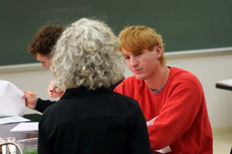 a man sitting in a classroom