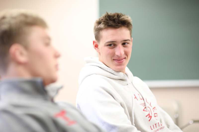a man in a white sweatshirt