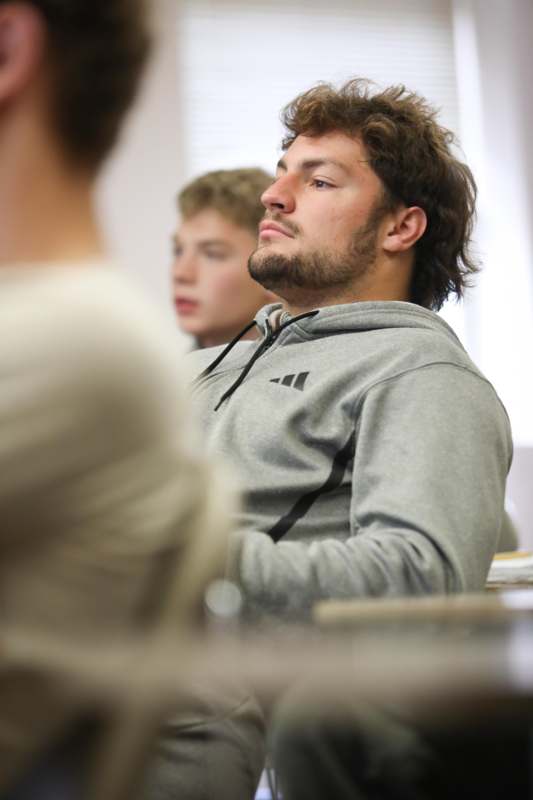 a man sitting in a classroom