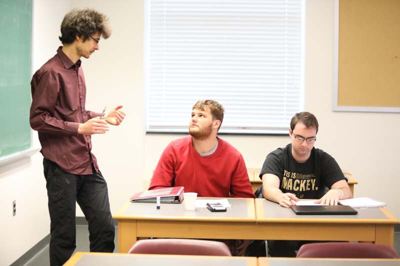a group of people sitting at a table
