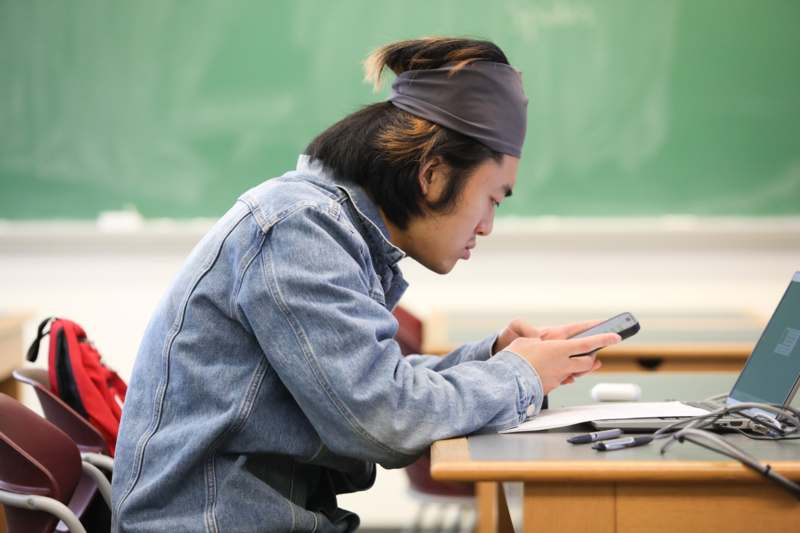 a man looking at his phone