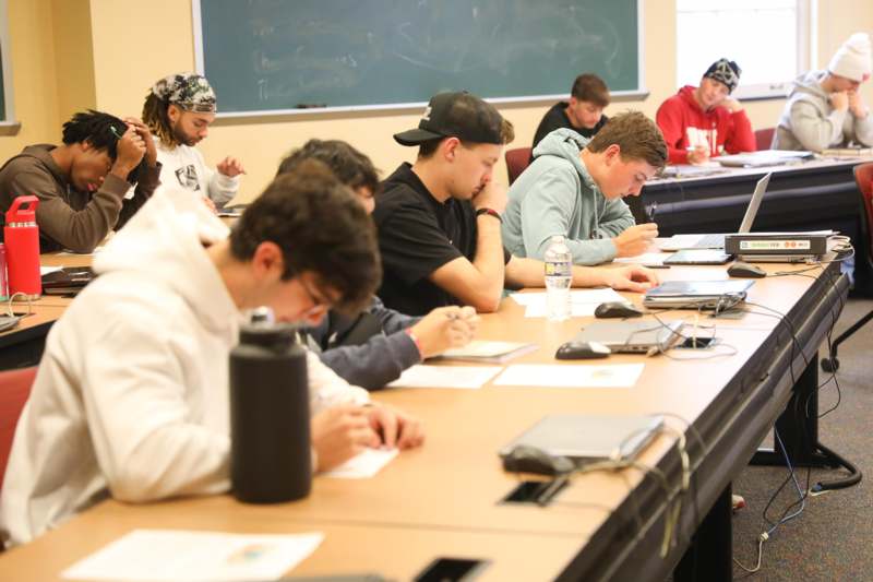 a group of people sitting at a table