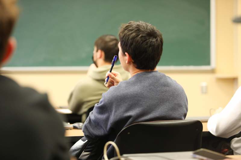 a man sitting in a classroom