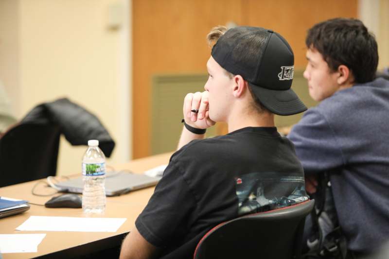 a group of people sitting at a table