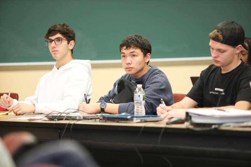a group of people sitting at a table