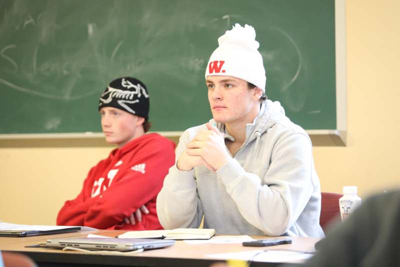 a group of people sitting at a table