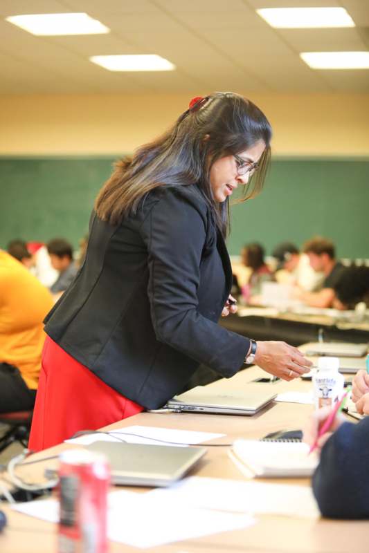 a woman standing at a table