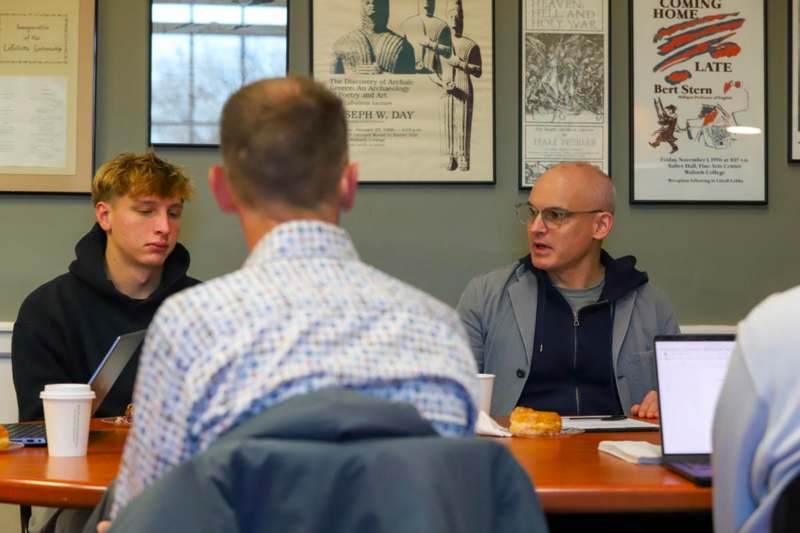 a group of people sitting at a table