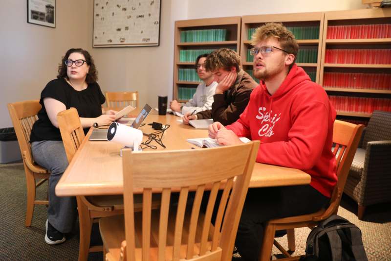 a group of people sitting at a table