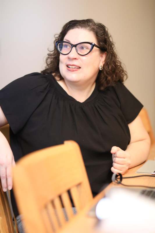 a woman sitting at a table