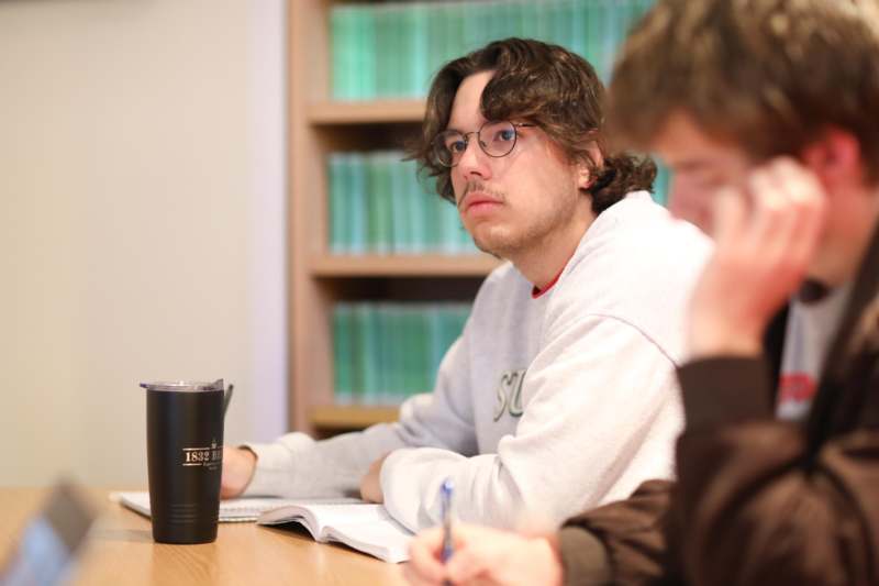 a group of people sitting at a table