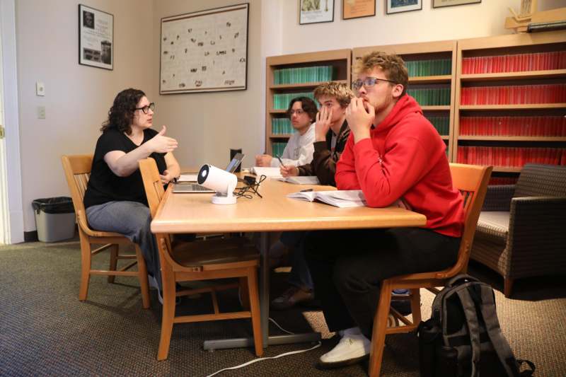 a group of people sitting at a table