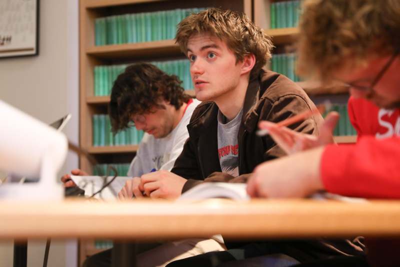a group of people sitting at a table
