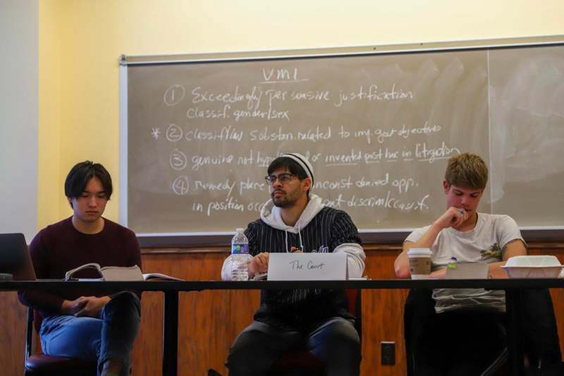 a group of people sitting at a table