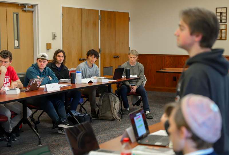 a group of people sitting at a table