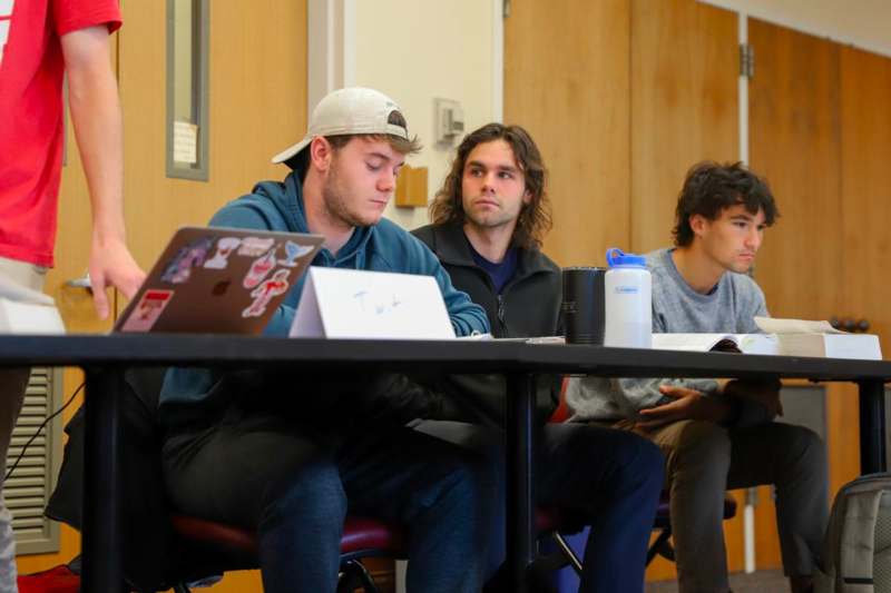 a group of people sitting at a table