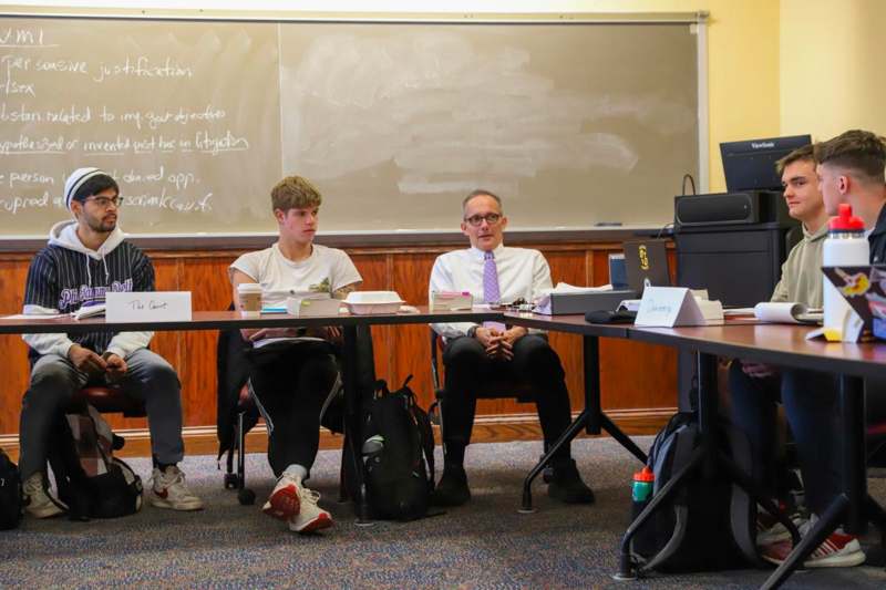 a group of people sitting at a table