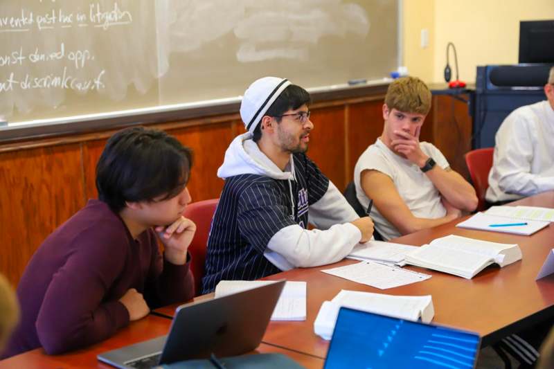 a group of people sitting at a table