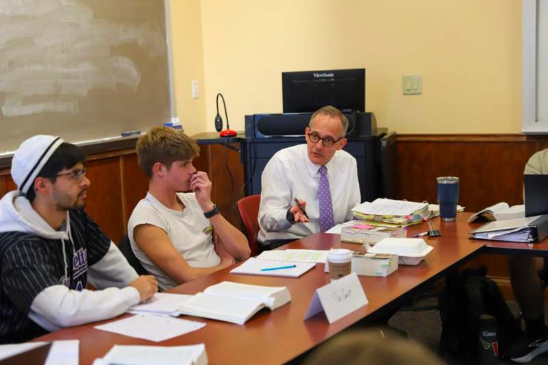 a group of people sitting at a table