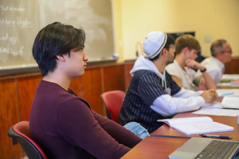 a group of people sitting at a table