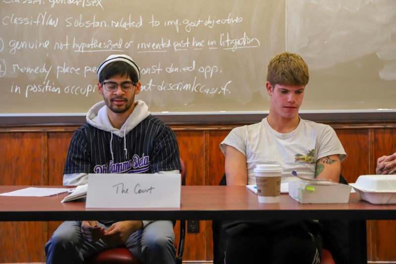 two men sitting at a table