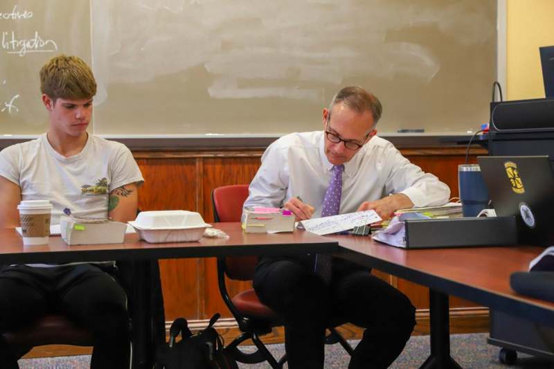 a man and woman sitting at a table