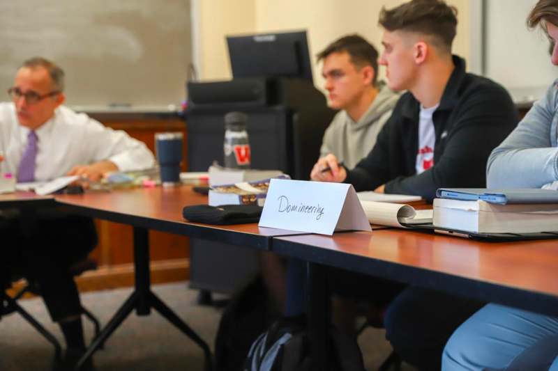 a group of people sitting at a table