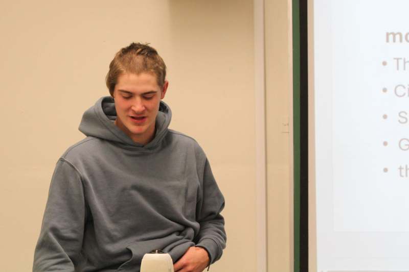 a man in a grey sweatshirt