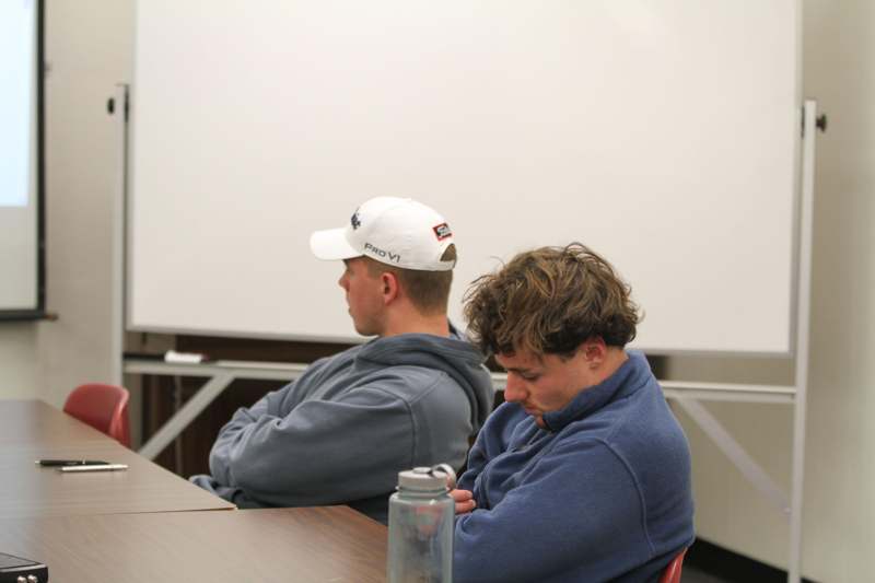 two men sitting at a table
