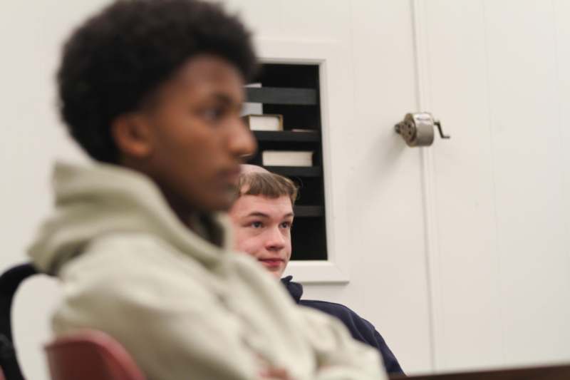 a group of people sitting in a room