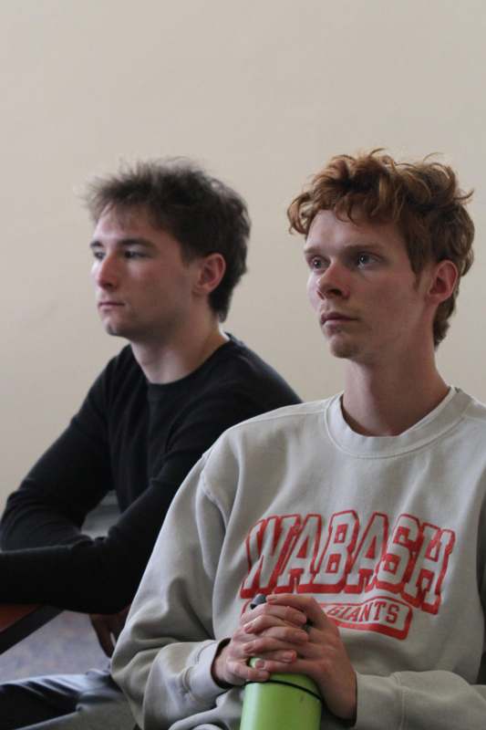 a group of men sitting in a room